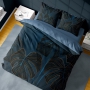 Navy blue bed linen with monstera leaves theme
