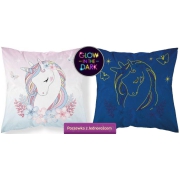 A small square pillowcase with a unicorn glowing in the dark